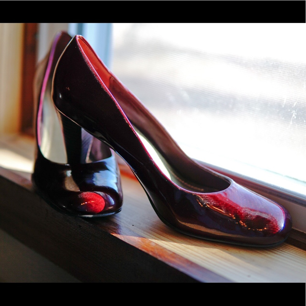 Burgandy patent leather dress shoes.